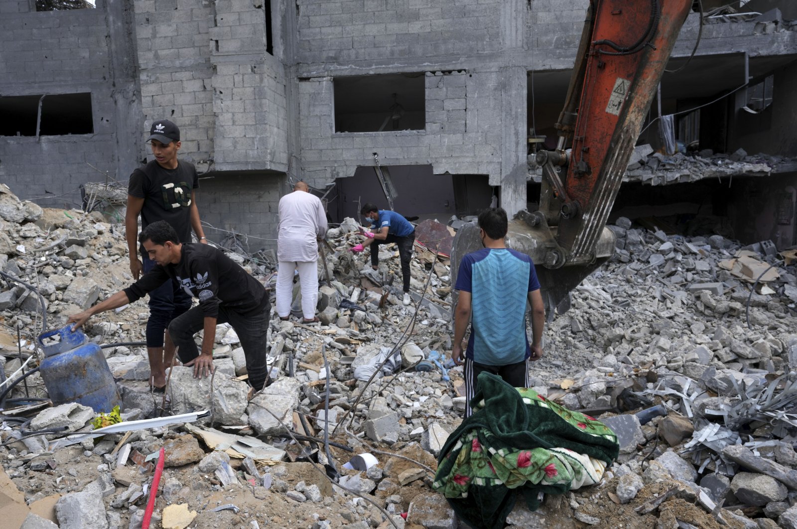 Palestinians recover the bodies of the al Meghari family killed in the Israeli bombardment of the Gaza Strip, Bureij refugee camp, Gaza Strip, Nov. 14, 2023. (AP Photo)