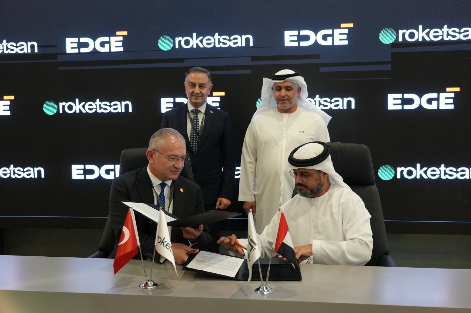 The signing ceremony of the cooperation between Roketsan and EDGE Group was held with the participation of Roketsan Advanced Technologies and Systems Deputy General Manager Cenk Önen (front L), Roketsan Market Development and Promotion Director Mustafa Odabaş (back L) and EDGE Group officials, Dubai, United Arab Emirates, Nov. 16, 2023. (AA Photo)