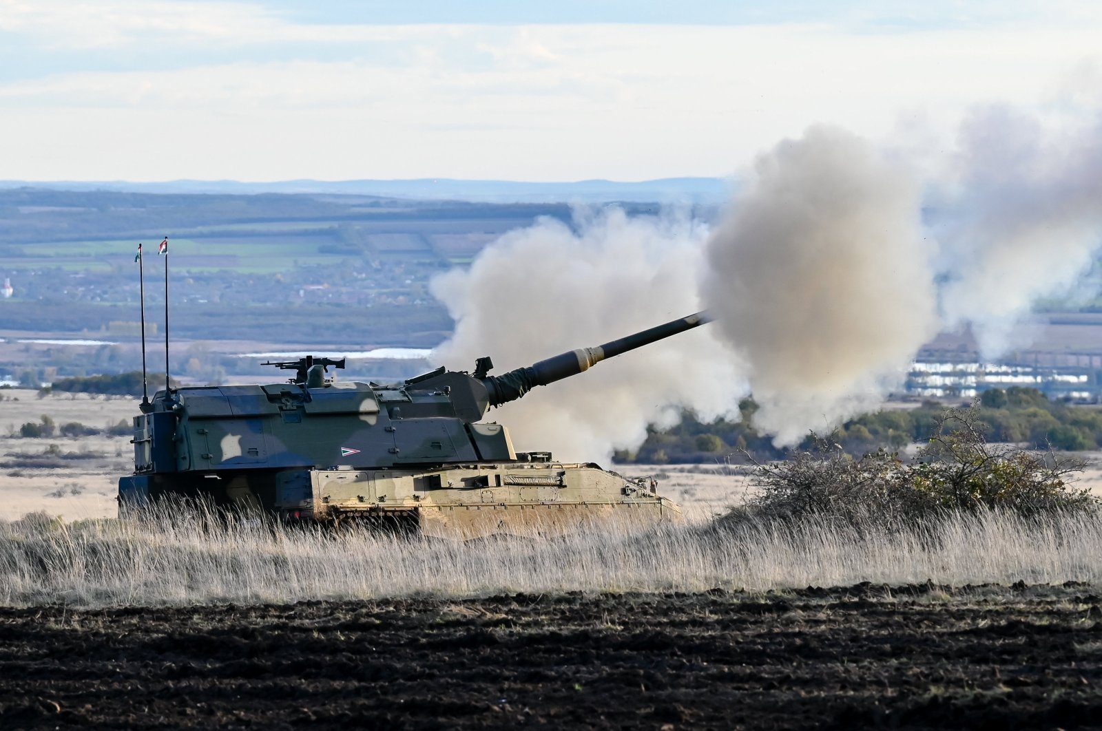 A PzH 2000 155 mm self-propelled howitzer participates in a live fire drill during the Bakonykut station of the Adaptive Hussars 2023 multinational domestic military exercise with the participation of NATO forces in Bakonykut, Hungary, Nov. 16, 2023.  (EPA Photo)