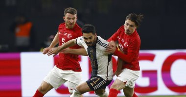 Germany&#039;s İlkay Gündoğan (C) in action against Türkiye&#039;s Salih Özcan  (L) and Abdülkadır Ömür (R)  during the international friendly match ,Berlin, Germany, Nov. 18, 2023.  (EPA Photo)