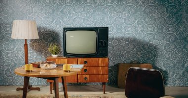 It took over a decade of innovation to bring the first TV sets to the market, initially seen as a luxury few could afford. (Getty Images Photo)