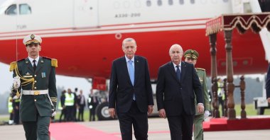 President Recep Tayyip Erdoğan (L) and Algerian President Abdelmadjid Tebboune are seen at the airport in Algiers, Algeria, Nov. 21, 2023. (IHA Photo)