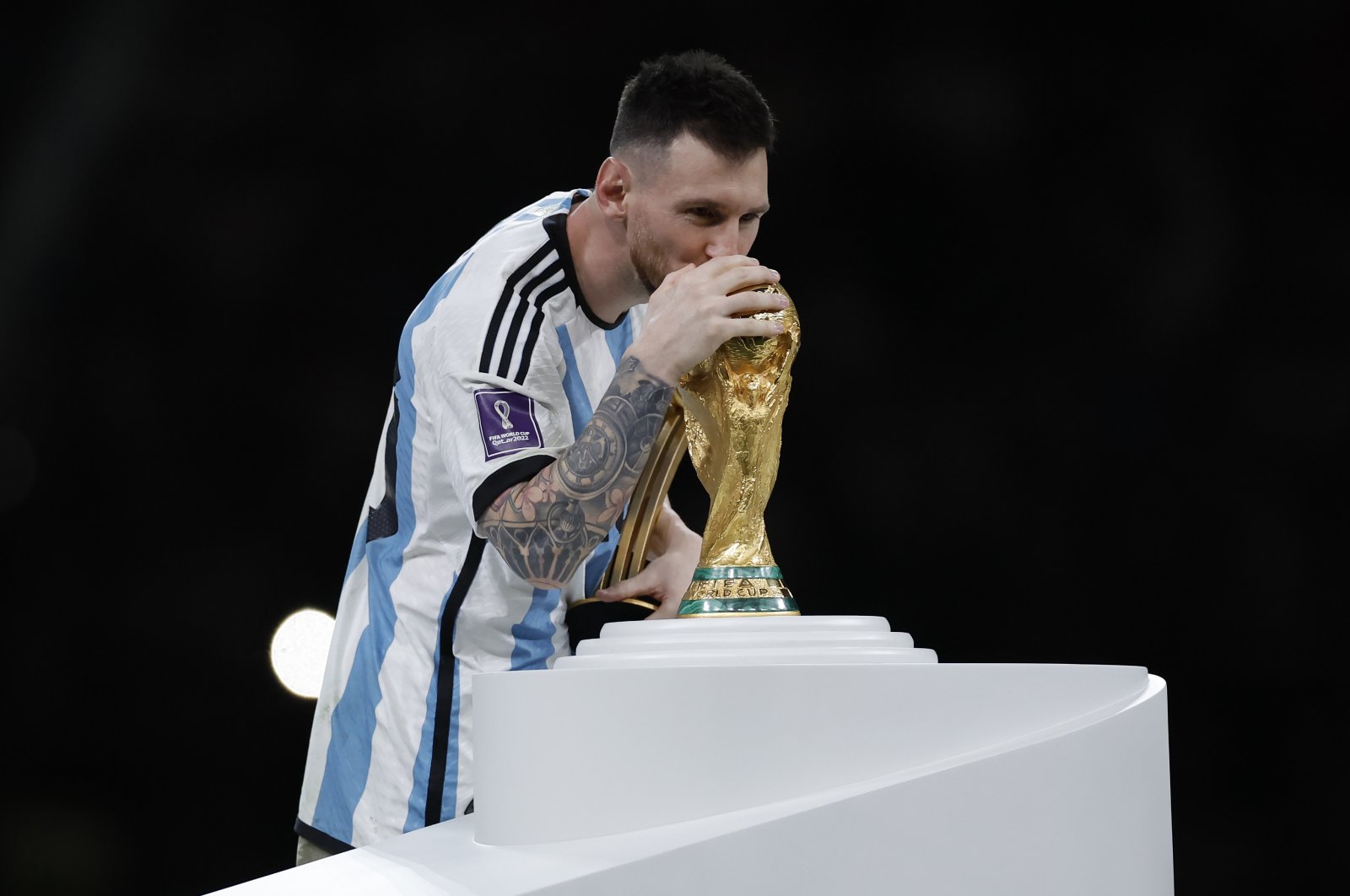 Argentina&#039;s Lionel Messi kisses the FIFA World Cup trophy at the presentation ceremony during the FIFA World Cup 2022 Final between Argentina and France at Lusail Iconic Stadium, Doha, Qatar, Dec 18, 2022. (Getty Images Photo)