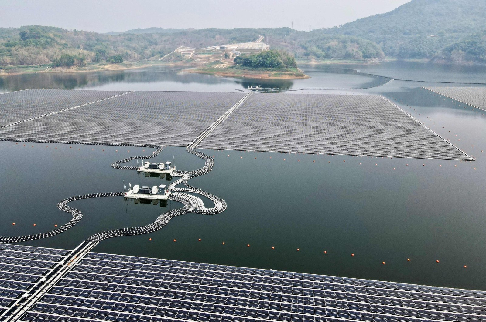 This aerial picture shows the newly built floating solar power plant that can generate 192 megawatts of peak electricity in cooperation between the Indonesian government and Masdar from the UAE, at Cirata Reservoir, West Java, Indonesia, Nov. 9, 2023. (AFP Photo)