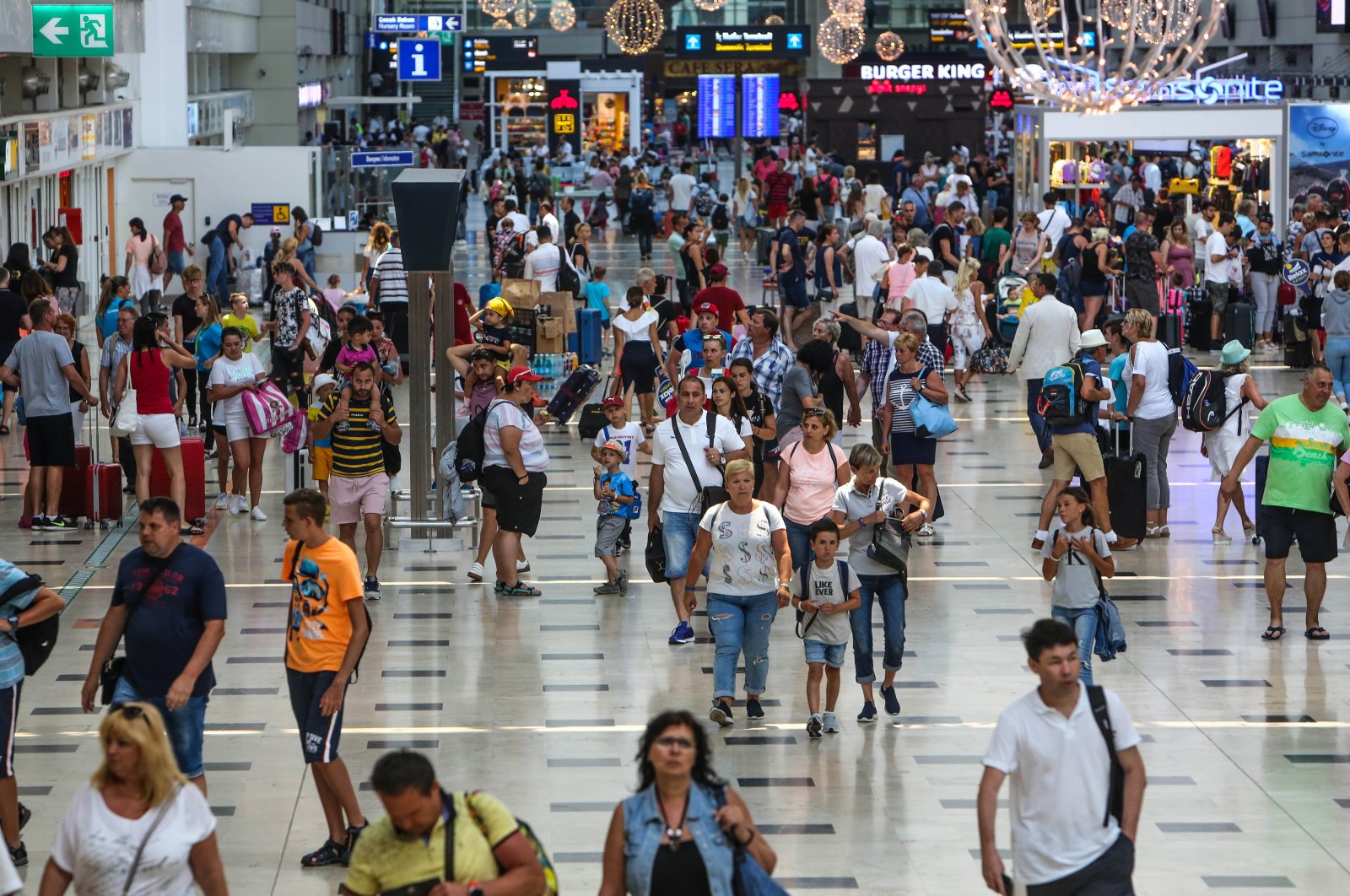 Passengers are seen at a terminal of busy Antalya Airport, Antalya, southern Türkiye, Nov. 14, 2023. (DHA Photo)