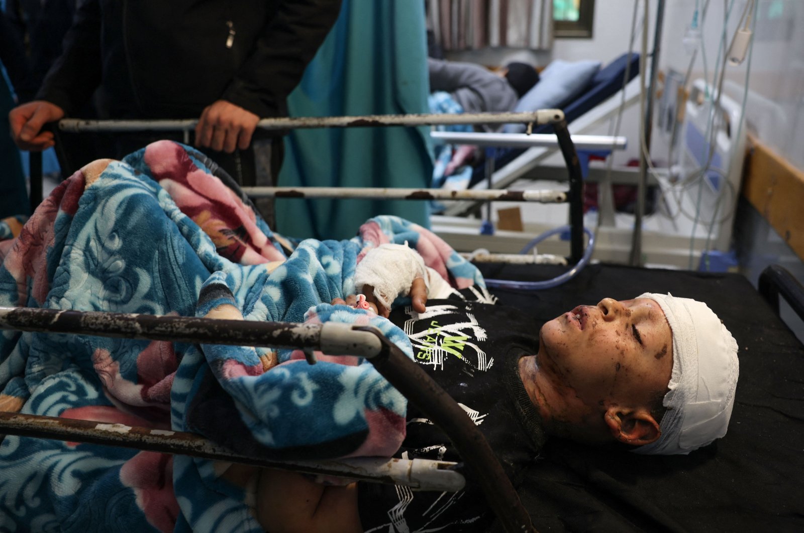 Wounded Palestinian child Mohammed Wesam Qadora from the Jabalia refugee camp arrives at the Naser Hospital at Khan Younis after being transferred from the Indonesian Hospital to the southern Gaza Strip, Palestine, Nov. 21, 2023. (AFP Photo)