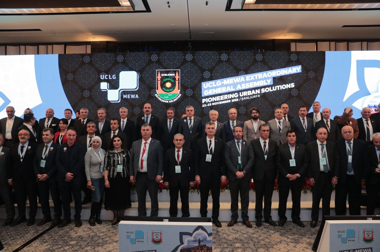 Participants of the United Cities and Local Governments Middle East and West Asia Section (UCLG-MEWA) Extraordinary General Assembly pose for a group photo in Şanlıurfa, Türkiye, Nov. 22, 2023. (IHA Photo)