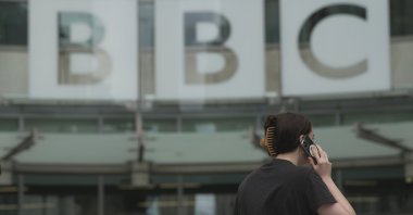 A woman walks outside the BBC Headquarters in London, U.K., July 11, 2023. (AP Photo)