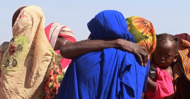 Women from El Geneina, West Darfur,  weep after receiving news of their missing relatives in Ardamata, as they waited for them in Adre, Chad, Nov. 7, 2023. (Reuters Photo)