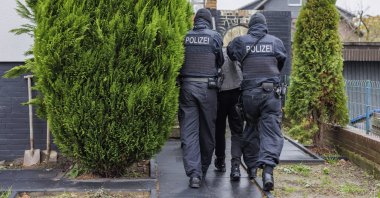 Police detain a suspected member of the far-right Reichsburger movement in Garbsen, Germany, Nov. 23, 2023. (AP Photo)