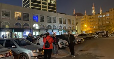 People are seen on the street following twin earthquakes in Malatya province, Nov. 23, 2023. (AA Photo)