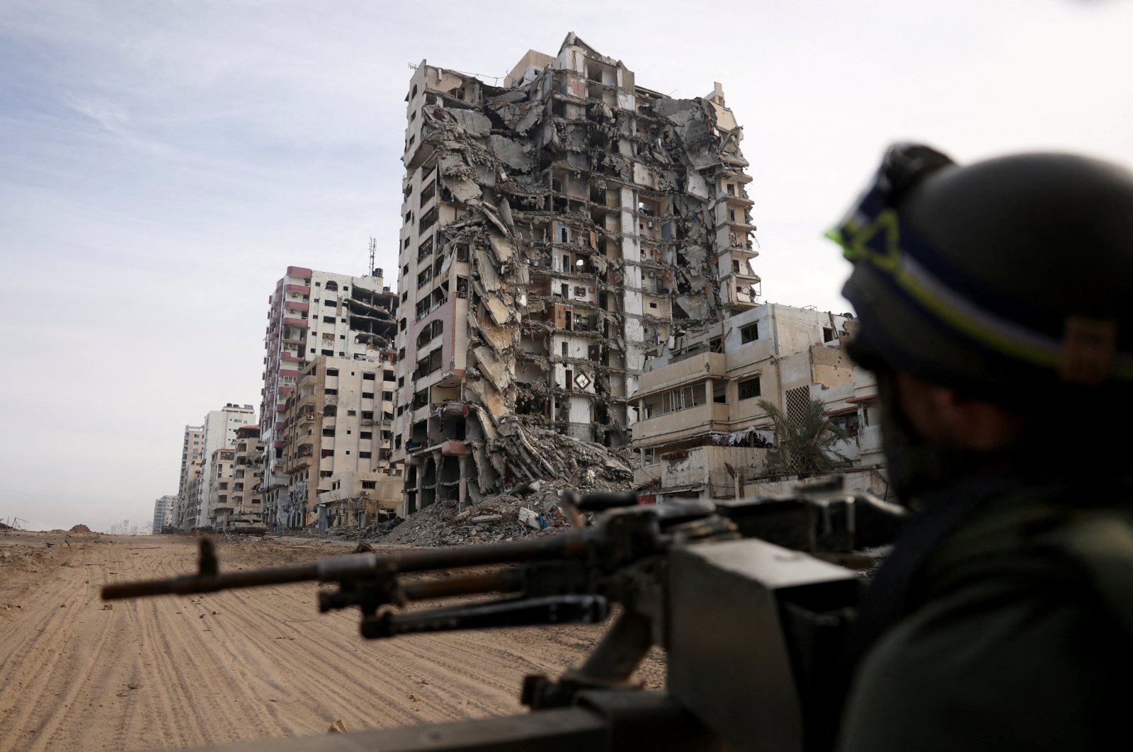 An Israeli soldier sits in an HMMWV (Humvee), amid the ongoing ground operation of the Israeli army against Hamas, in the northern Gaza Strip, Palestine, Nov. 22, 2023.  (Reuters Photo)