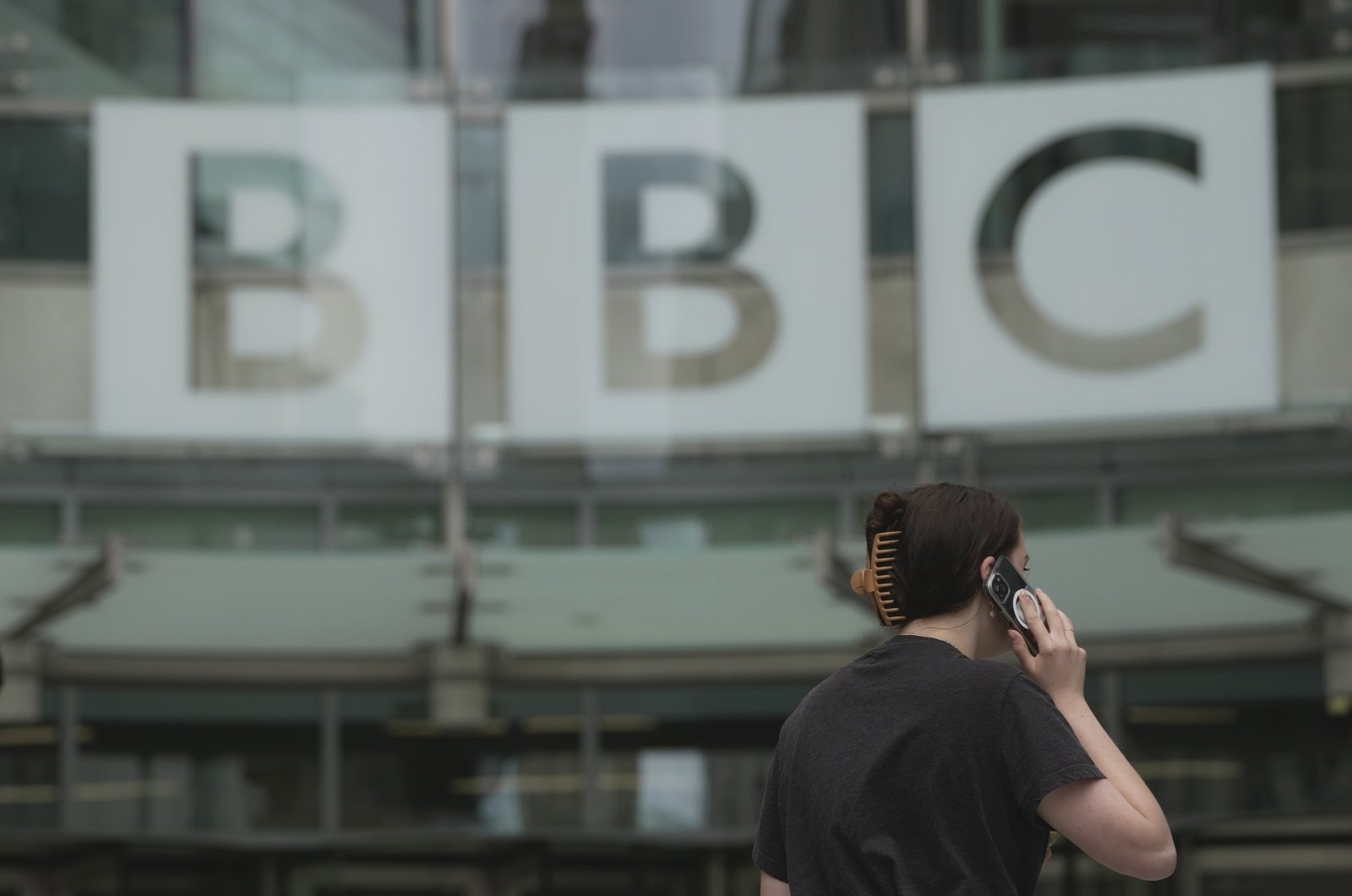 A woman walks outside the BBC Headquarters in London, U.K., July 11, 2023. (AP Photo)