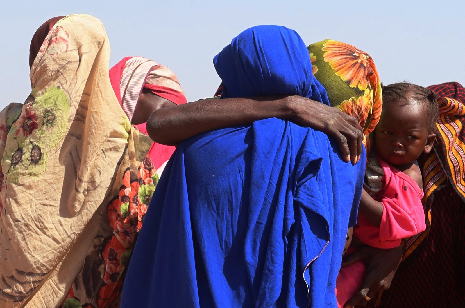 Women from El Geneina, West Darfur,  weep after receiving news of their missing relatives in Ardamata, as they waited for them in Adre, Chad, Nov. 7, 2023. (Reuters Photo)