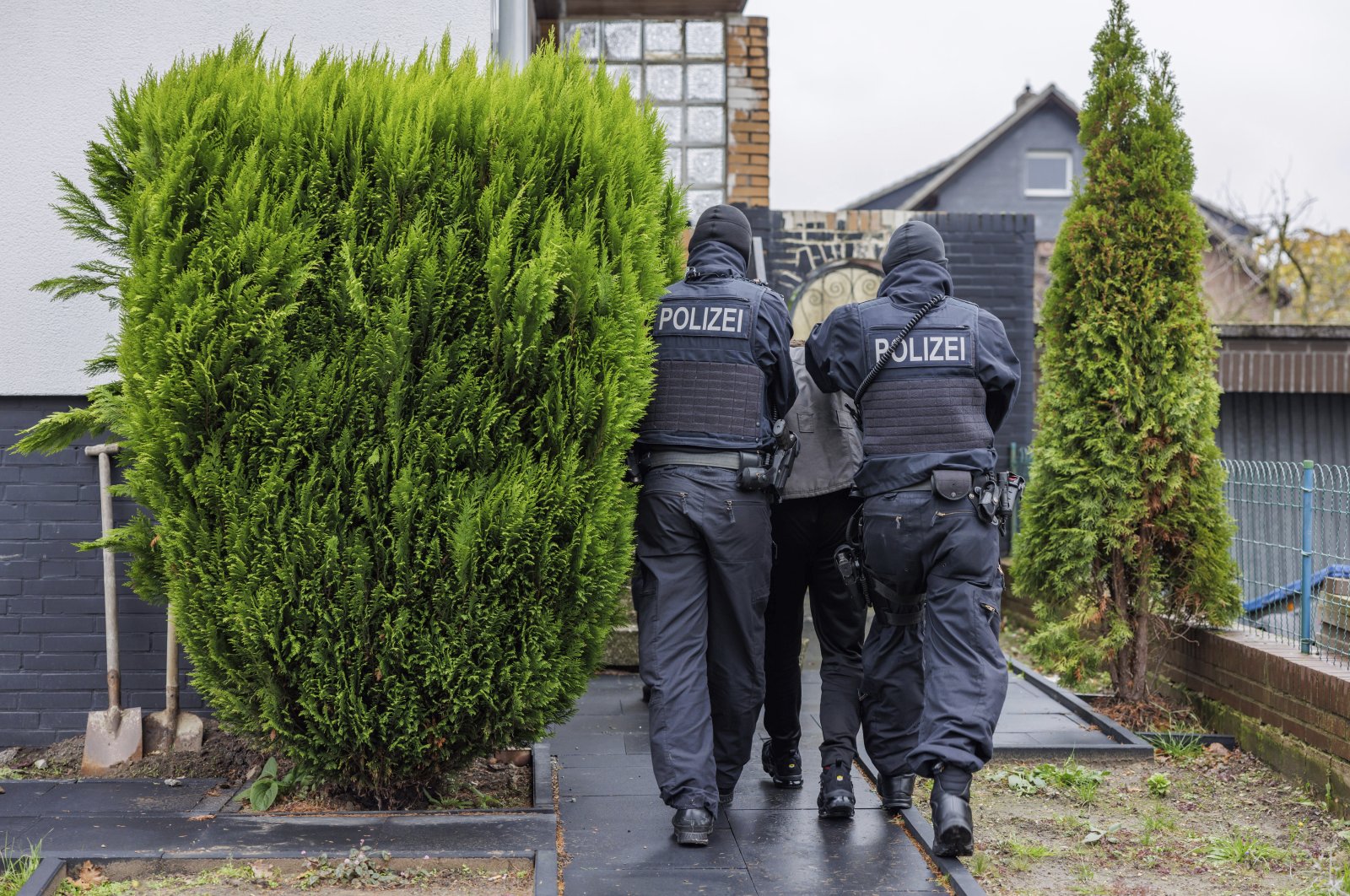 Police detain a suspected member of the far-right Reichsburger movement in Garbsen, Germany, Nov. 23, 2023. (AP Photo)