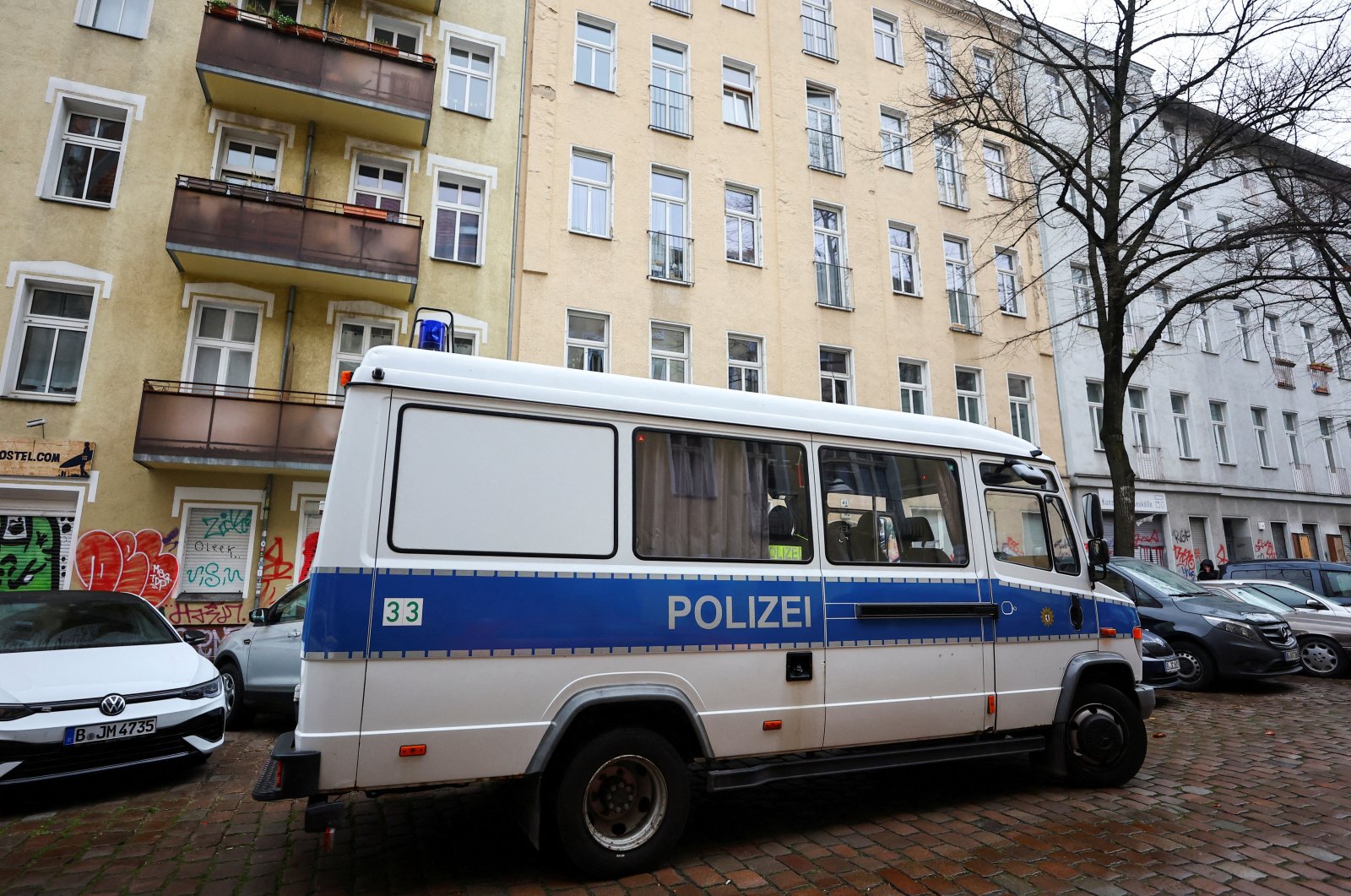 A German police vehicle is parked in front of an apartment building during a raid against people supporting the Palestinian group Hamas, in Berlin, Germany, Nov. 23, 2023. (Reuters Photo)