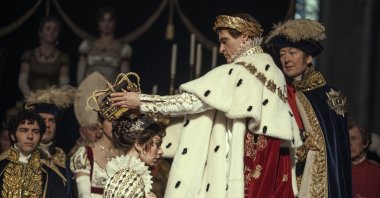 This image released by Apple TV  shows Vanessa Kirby, (foreground L) and Joaquin Phoenix in a scene from "Napoleon." (AP Photo)