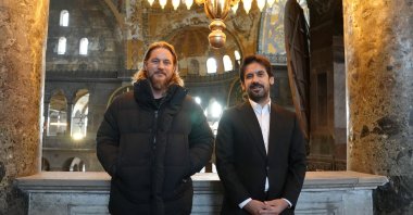 Hollywood actor Travis Fimmel (L), and Deputy Minister of Culture and Tourism Batuhan Mumcu (R) visit Hagia Sophia Grand Mosque. Istanbul, Türkiye, Nov. 23, 2023. (AA Photo)