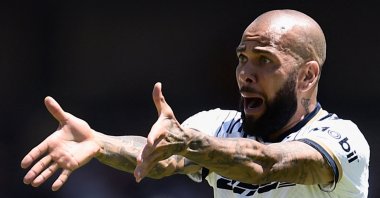 Ex-Pumas' Brazilian Dani Alves gestures during their Mexican Apertura 2022 tournament football match against Monterrey at the University Olympic stadium, Mexico City, Mexico, July 31, 2022. (AFP Photo)