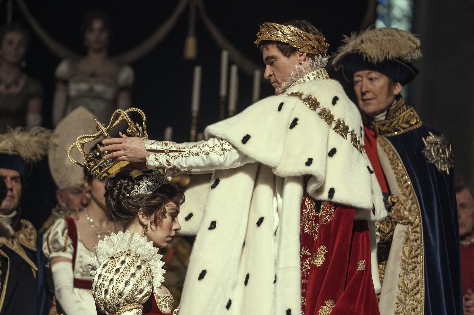 This image released by Apple TV  shows Vanessa Kirby, (foreground L) and Joaquin Phoenix in a scene from &quot;Napoleon.&quot; (AP Photo)