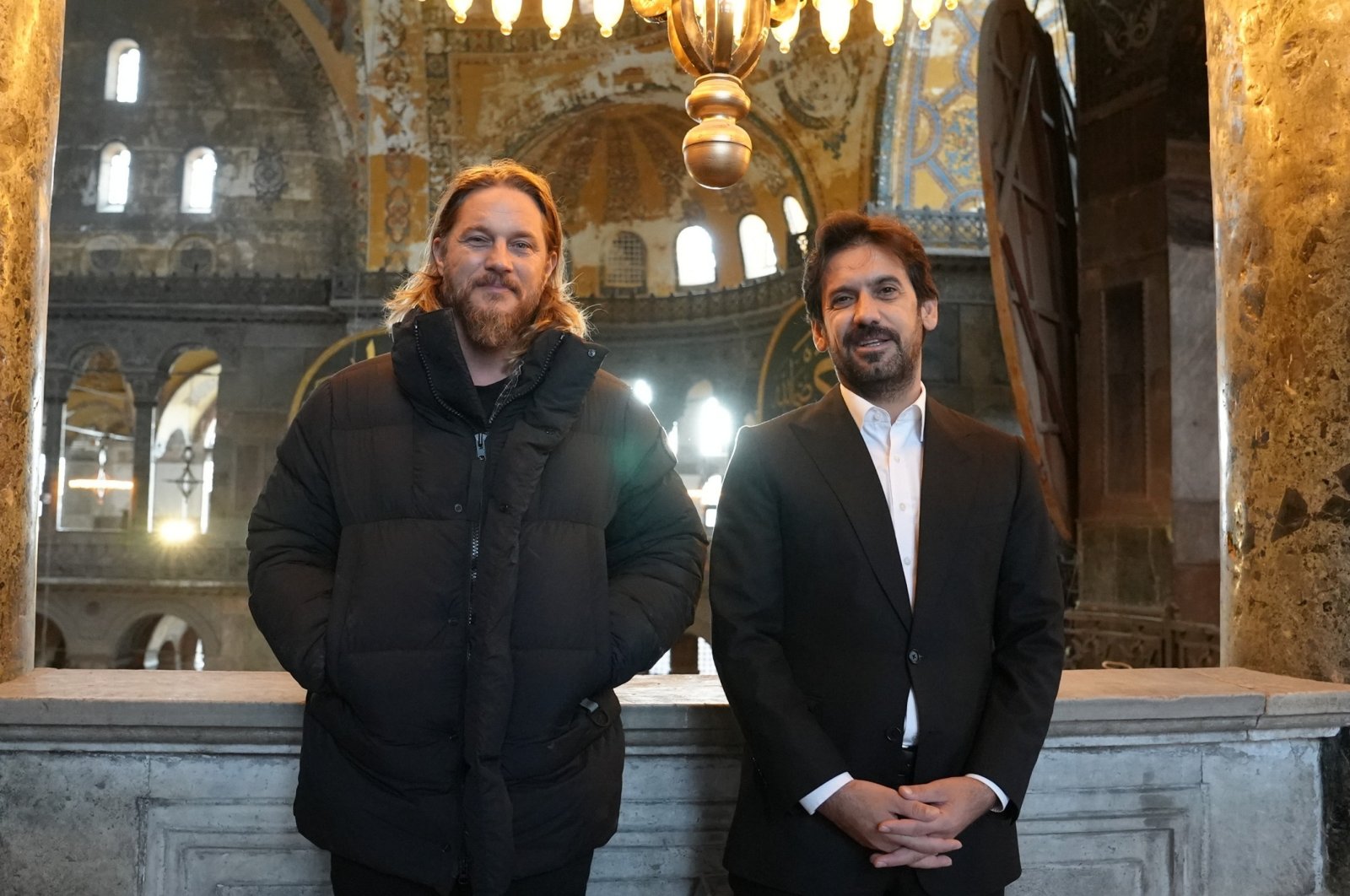 Hollywood actor Travis Fimmel (L), and Deputy Minister of Culture and Tourism Batuhan Mumcu (R) visit Hagia Sophia Grand Mosque. Istanbul, Türkiye, Nov. 23, 2023. (AA Photo)