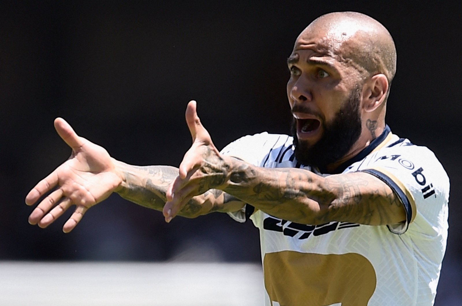 Ex-Pumas&#039; Brazilian Dani Alves gestures during their Mexican Apertura 2022 tournament football match against Monterrey at the University Olympic stadium, Mexico City, Mexico, July 31, 2022. (AFP Photo)