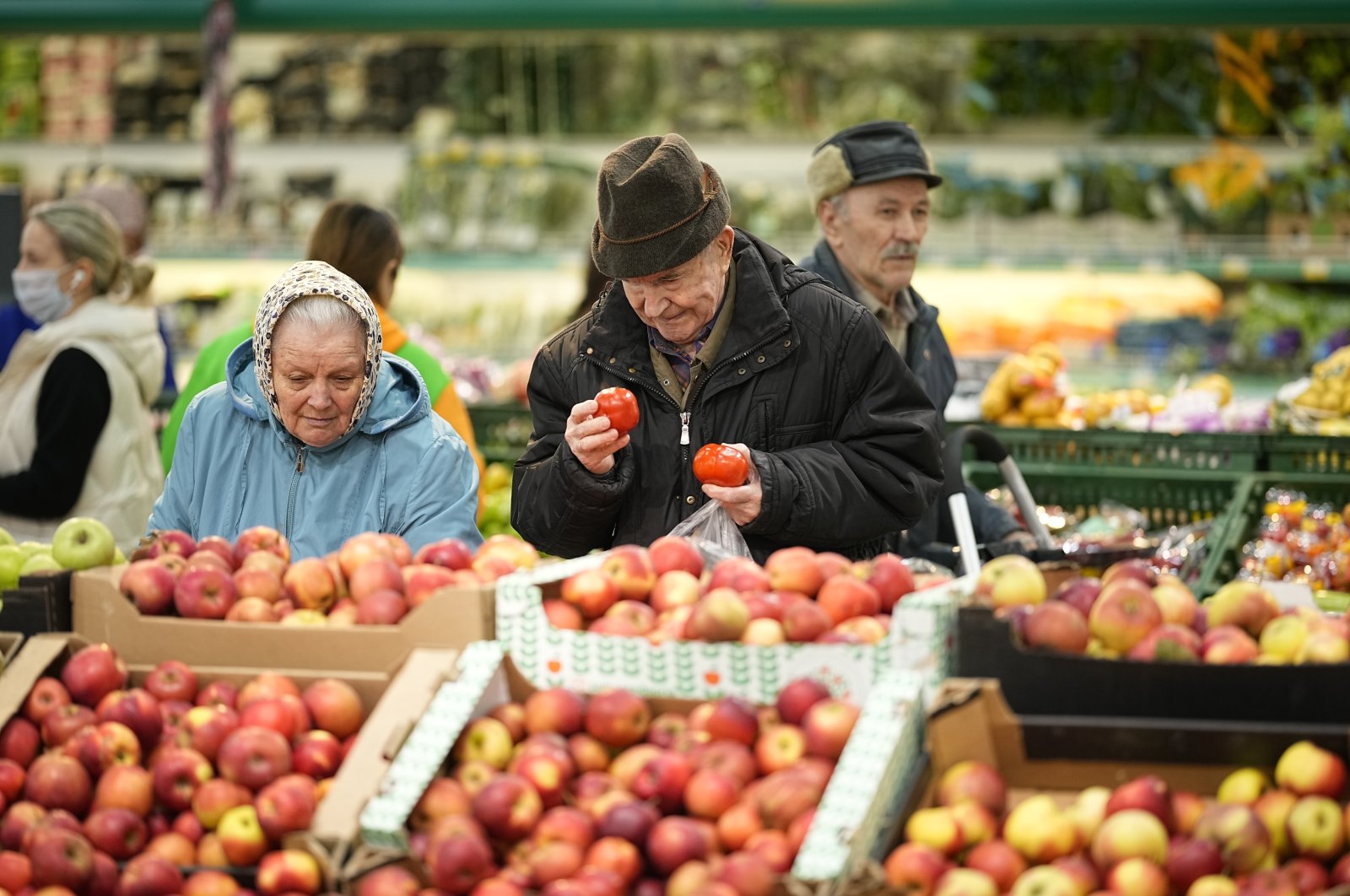 People buy fruit at a supermarket, Moscow, Russia, Nov. 3, 2023. (AP Photo)