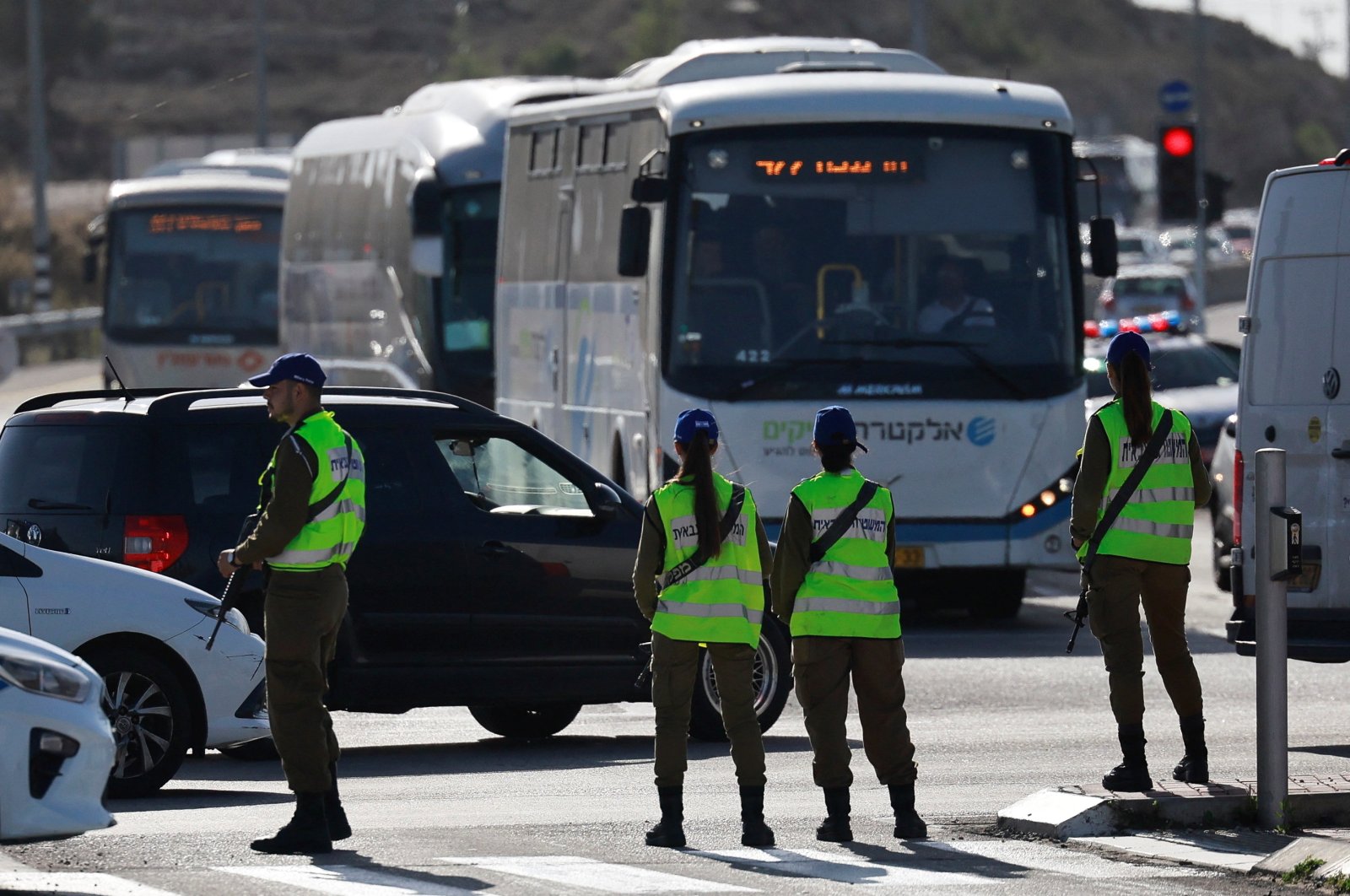 Israeli military personnel stand guard as a van carrying Palestinian captives arrive at an Israeli military prison, Ofer, near Ramallah, Palestine, Nov. 24, 2023. (Reuters Photo)