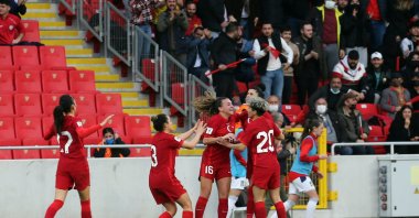 Turkish women's football players celebrate scoring a goal during the FIFA Women's World Cup match against Serbia at Gürsel Aksel Stadium, Izmir, Türkiye, Feb. 23, 2022. (Getty Images Photo)