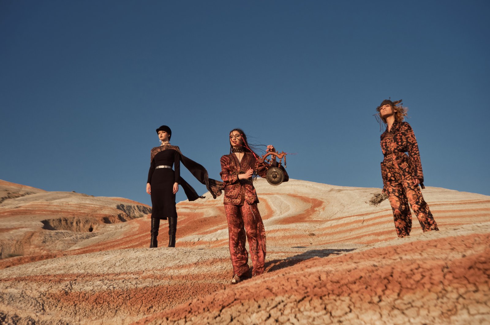 Models pose on the Khizi Mountains, Baku, Azerbaijan, June 2, 2022. (Getty Images Photo)