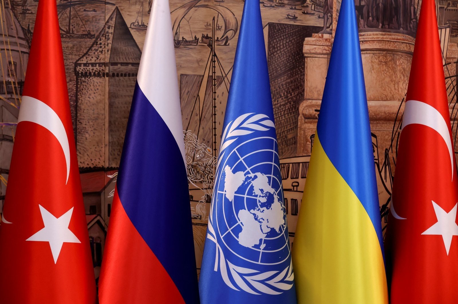 Flags of Türkiye, Russia, the United Nations and Ukraine are seen on the day of a signing ceremony in Istanbul, Türkiye, July 22, 2022. (Reuters Photo)