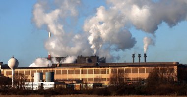 Smoke rises from chimneys at a factory in the port of Dunkirk, France, Jan. 19, 2023. (Reuters Photo)