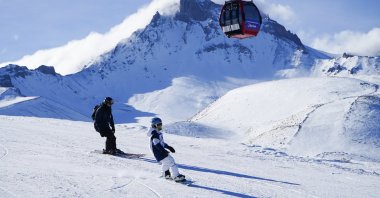 A group of people is seen skiing on the slopes of Erciyes Mountain at Erciyes Ski Center, Kayseri, central Türkiye, Nov. 26, 2023. (AA Photo)