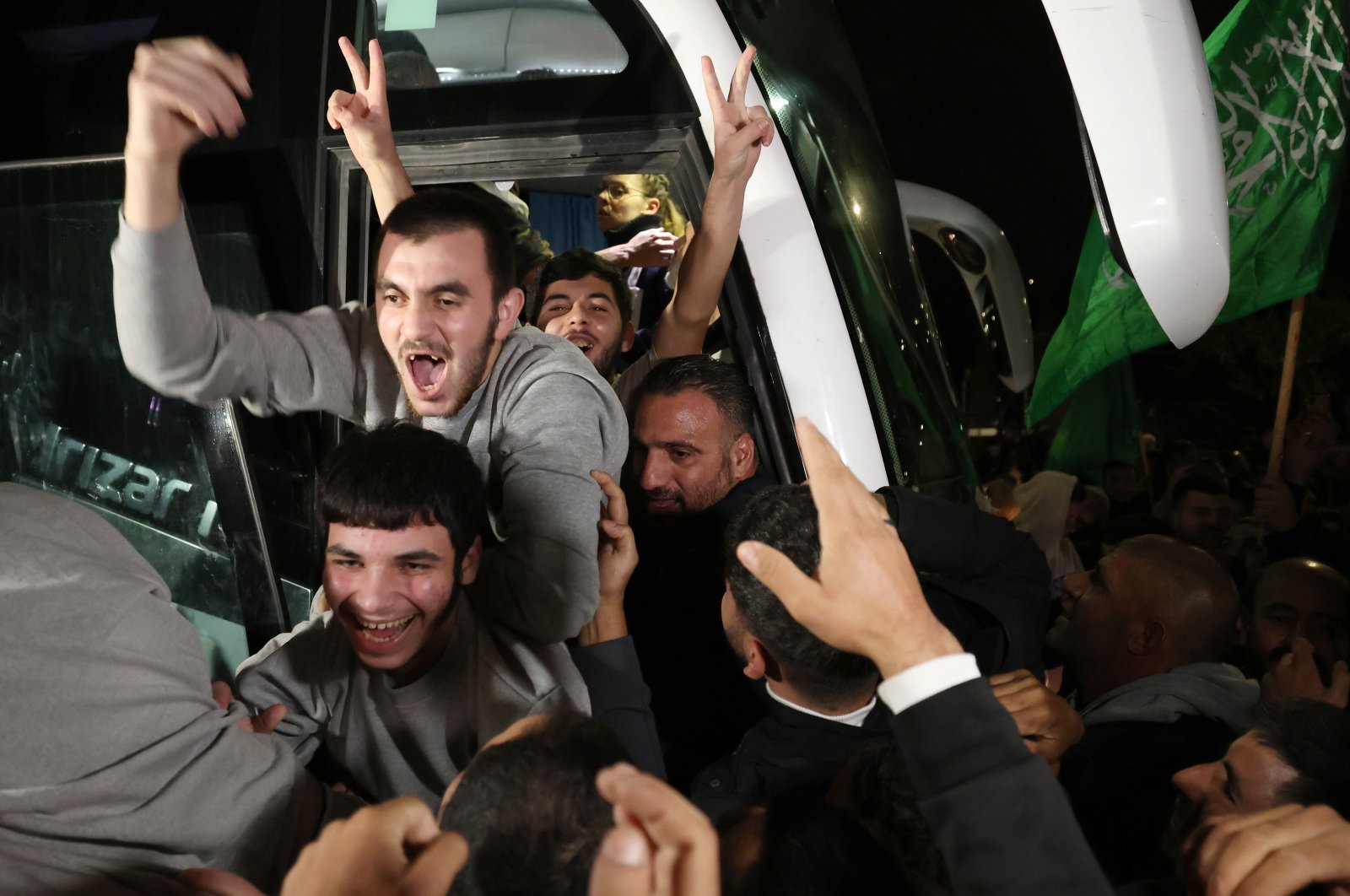 Palestinian prisoners freed from the Ofer Israeli military prison react as they get greeted by crowds awaiting their return in Beitonia, near Ramallah, West Bank, Nov. 28, 2023. (EPA Photo)