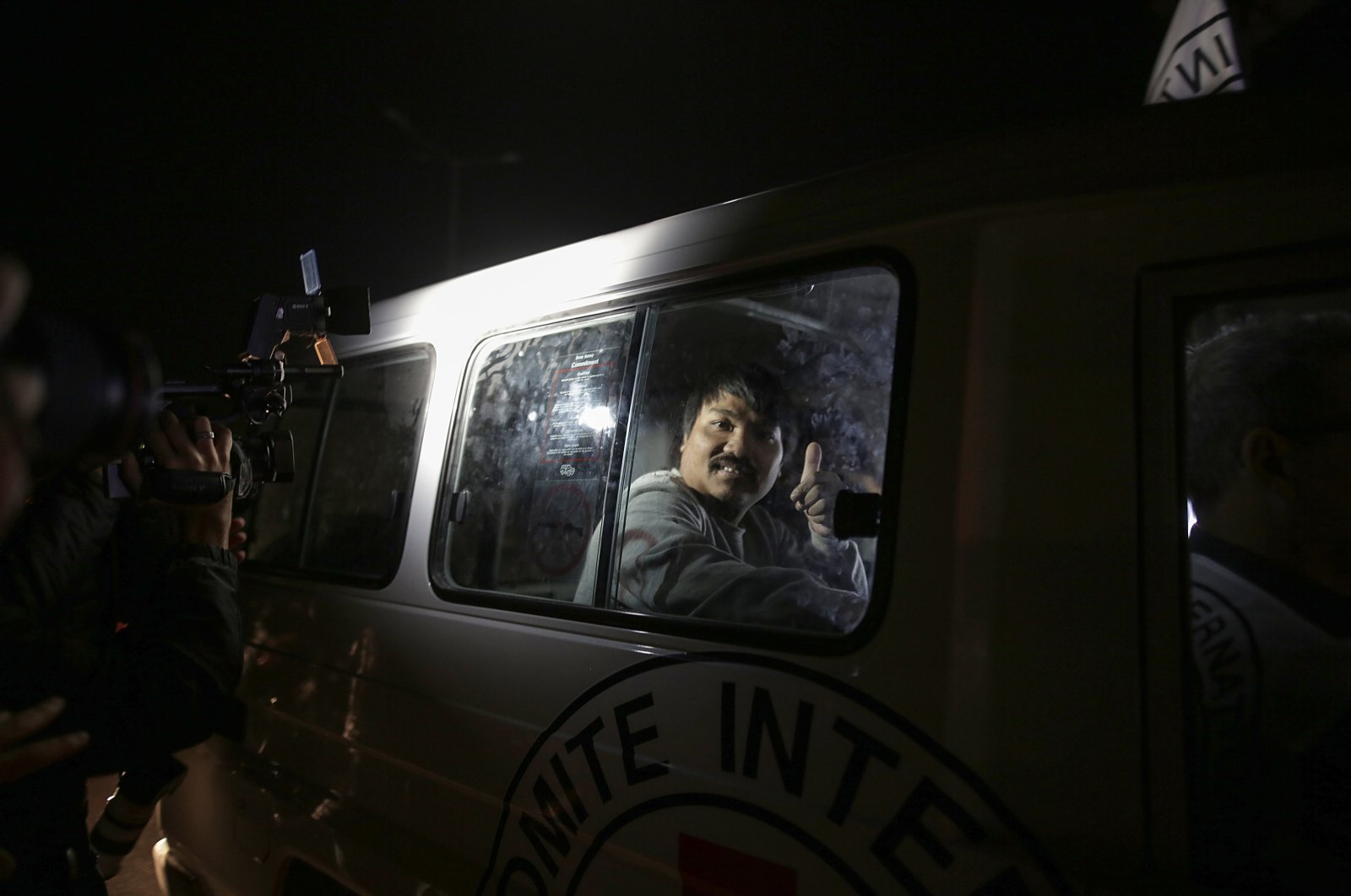 An International Red Cross vehicle, carrying three Thai nationals and one Russian national released by Hamas, heads toward the Rafah border crossing between the southern Gaza Strip and Egypt, Palestine, Nov. 26, 2023. (EPA Photo)