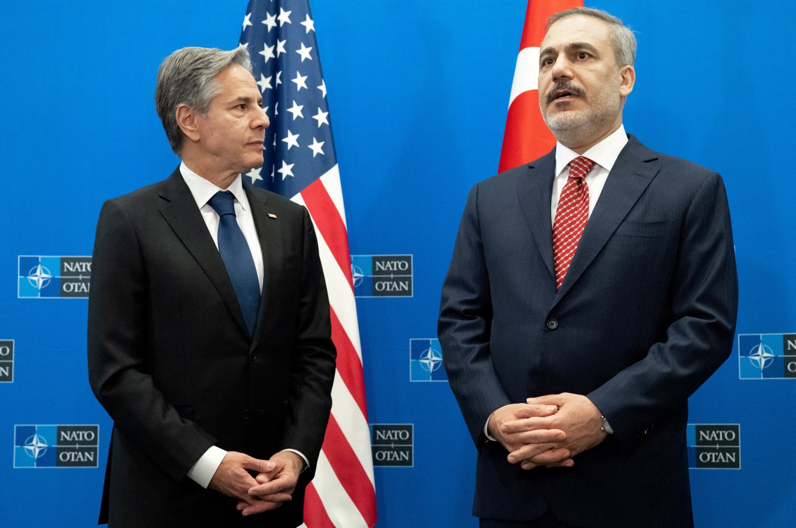 Foreign Minister Hakan Fidan (R) and U.S. Secretary of State Antony Blinken make a statement prior to their meeting, on the sidelines of the NATO Foreign Ministers meeting in Brussels, Belgium, Nov. 28, 2023. (Reuters Photo)