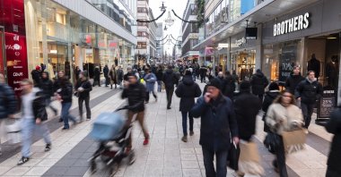 People walk on Drottninggatan in Stockholm, Sweden, Nov. 24, 2023. (AP Photo)