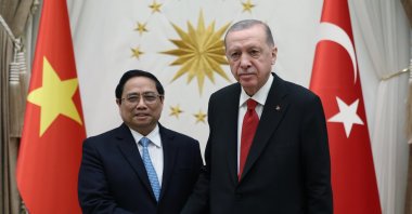 President Recep Tayyip Erdoğan (R) and Vietnamese Prime Minister Pham Minh Chinh shake hands ahead of their closed-door meeting in Ankara, Türkiye, Nov. 29, 2023. (AA Photo)