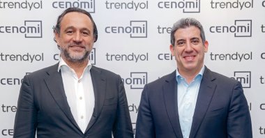 Çağlayan Çetin, the president of Trendyol Group (L), poses next to Mohamad Mourad, CEO of Cenomi Group, Istanbul, Türkiye, Nov. 28, 2023. (IHA Photo)