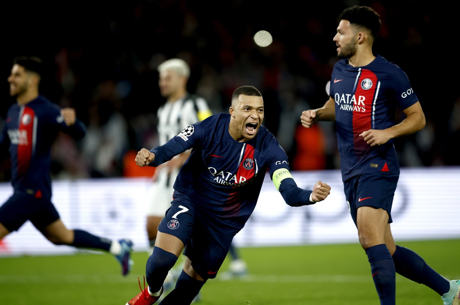 PSG&#039;s Kylian Mbappe (L) celebrates after scoring the 1-1 with a penalty during the UEFA Champions League Group F match against Newcastle United, Paris, France, Nov. 28, 2023. (EPA Photo)