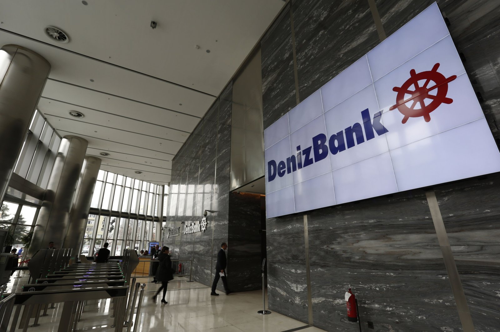 The logo of Denizbank is displayed on a screen at the bank&#039;s headquarters in Istanbul, Türkiye, March 2, 2016. (Reuters Photo)