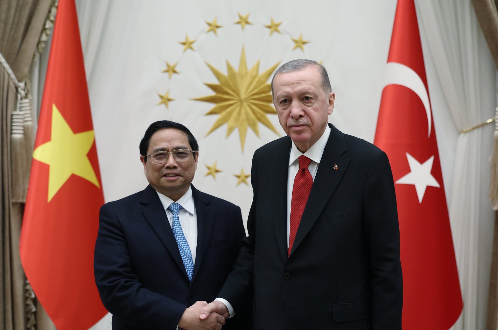 President Recep Tayyip Erdoğan (R) and Vietnamese Prime Minister Pham Minh Chinh shake hands ahead of their closed-door meeting in Ankara, Türkiye, Nov. 29, 2023. (AA Photo)