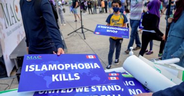 Attendees return signs after a rally to highlight Islamophobia, in Toronto, Ontario, Canada, June 18, 2021. (Reuters Photo)
