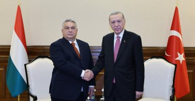 President Erdoğan shakes hands with Hungarian PM Viktor Orban on the sidelines of a meeting in Astana, Kazakhstan, November 2, 2023. (İHA Photo) 