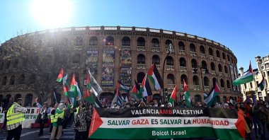 Protesters holding a banner reading "Valencia with Palestine. Saving Gaza is saving Humanity. Boycott of Israel" take part in a demonstration in support of the Palestinian people in Valencia, Spain, Nov. 19, 2023. (AFP Photo)