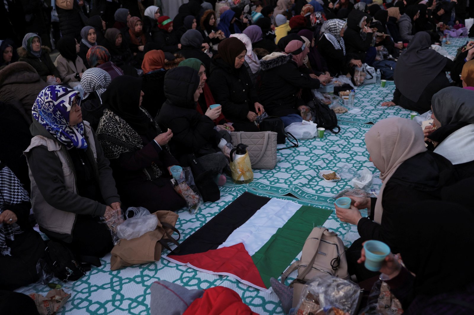 People gather for a dinner at Sultanahmet Square in solidarity with Palestinians in Gaza, during a temporary truce between the Palestinian resistance group Hamas and Israel, in Istanbul, Türkiye, Nov. 27, 2023. (Reuters Photo)