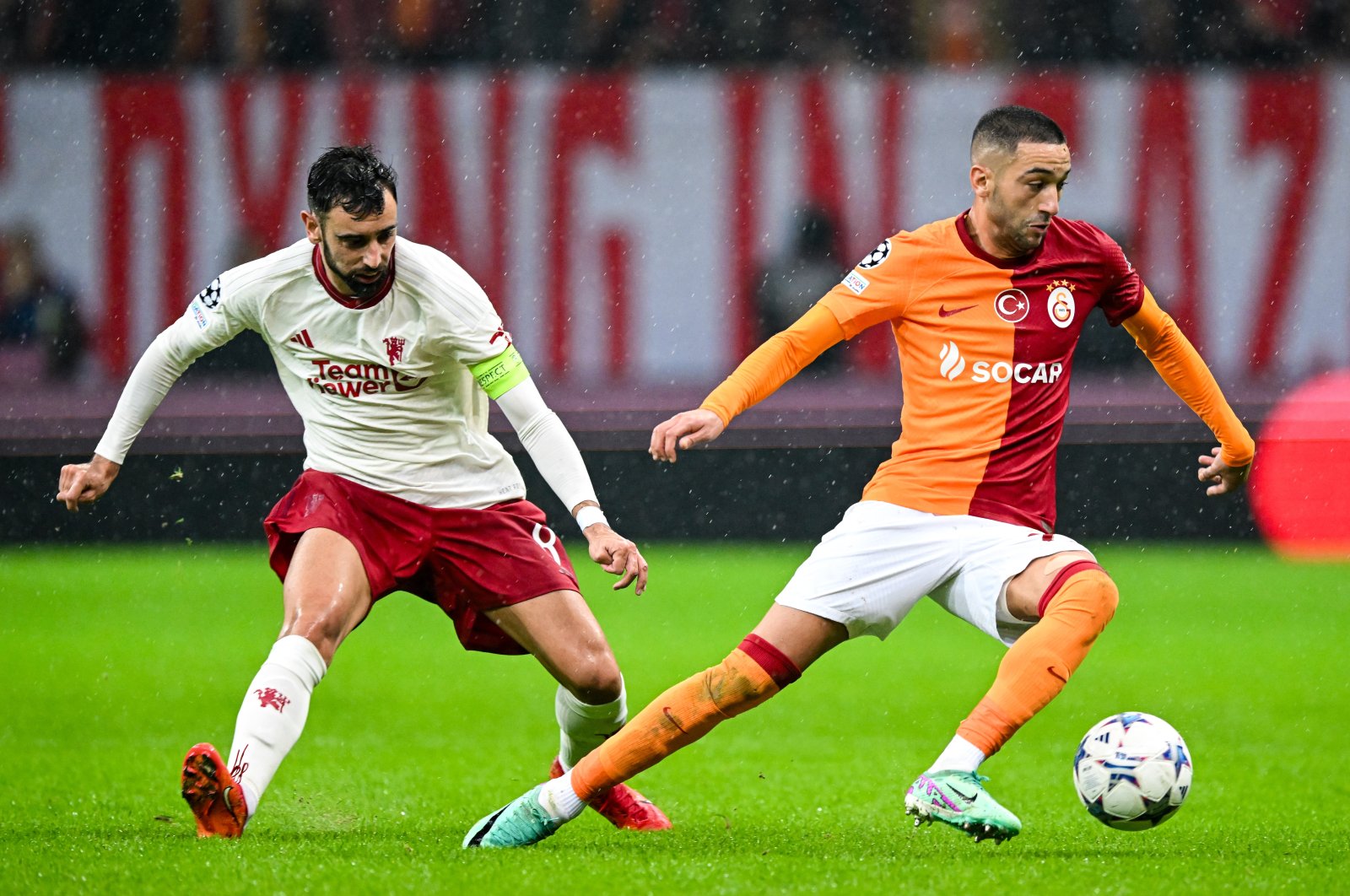 Galatasaray&#039;s Hakim Ziyech (R) in action with Manchester United&#039;s Bruno Fernandes during the UEFA Champions League Group A match at Ali Sami Yen Spor Kompleksi Stadium, Istanbul, Türkiye, Nov. 29.2023. (Getty Images Photo)