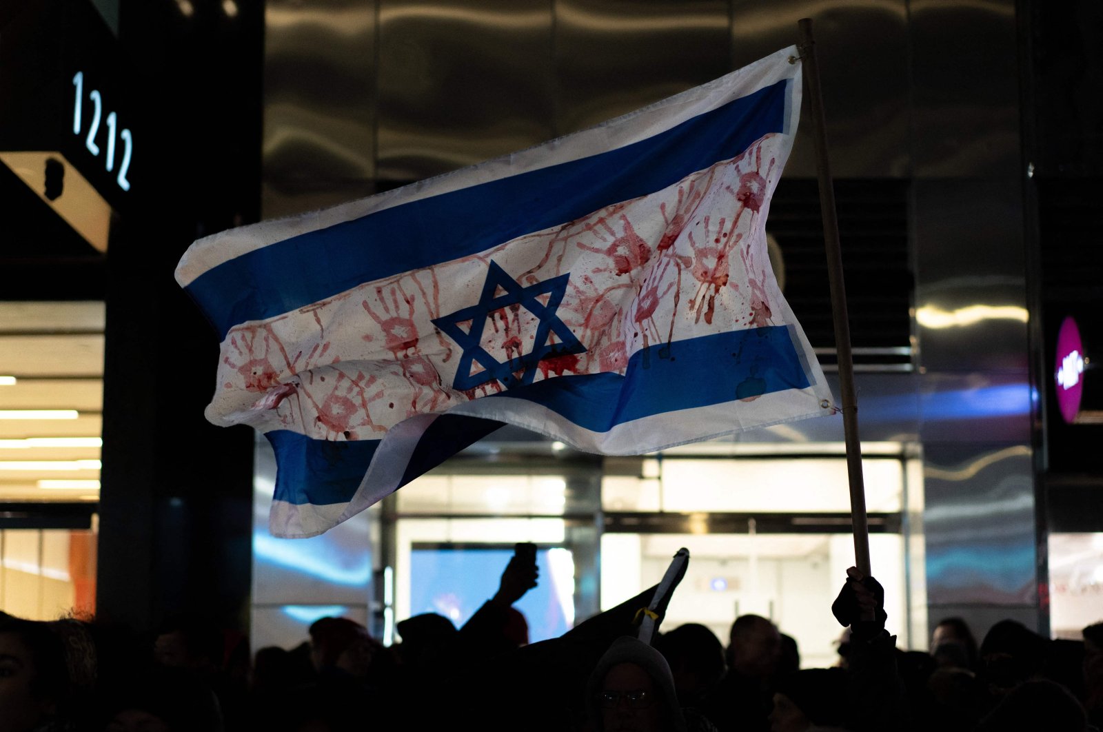 Pro-Palestine supporters gather for a rally at the News Corp. building near the Rockefeller tree lighting, New York City, U.S., Nov. 29, 2023. (AFP Photo)