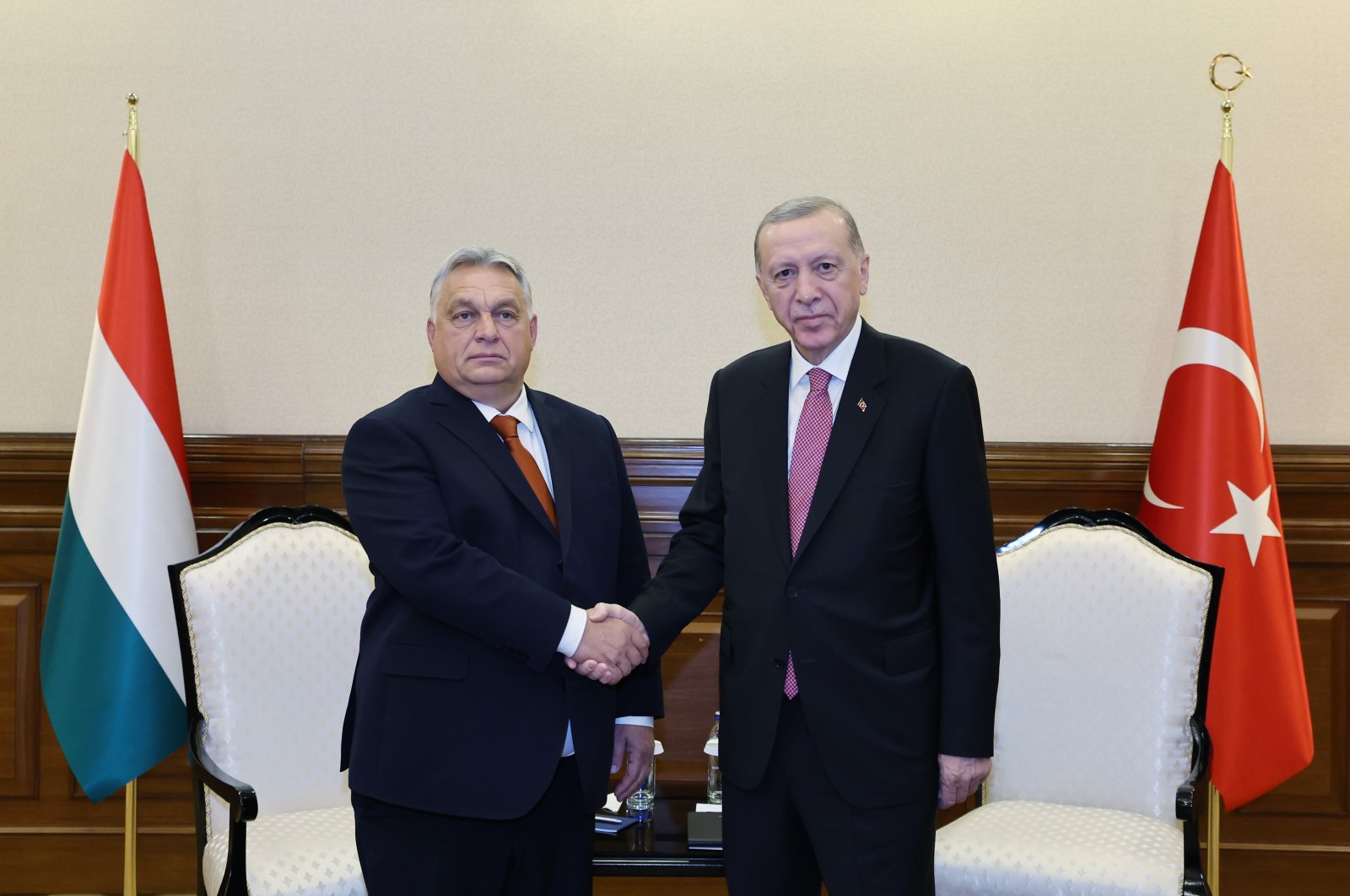 President Erdoğan shakes hands with Hungarian PM Viktor Orban on the sidelines of a meeting in Astana, Kazakhstan, November 2, 2023. (İHA Photo) 