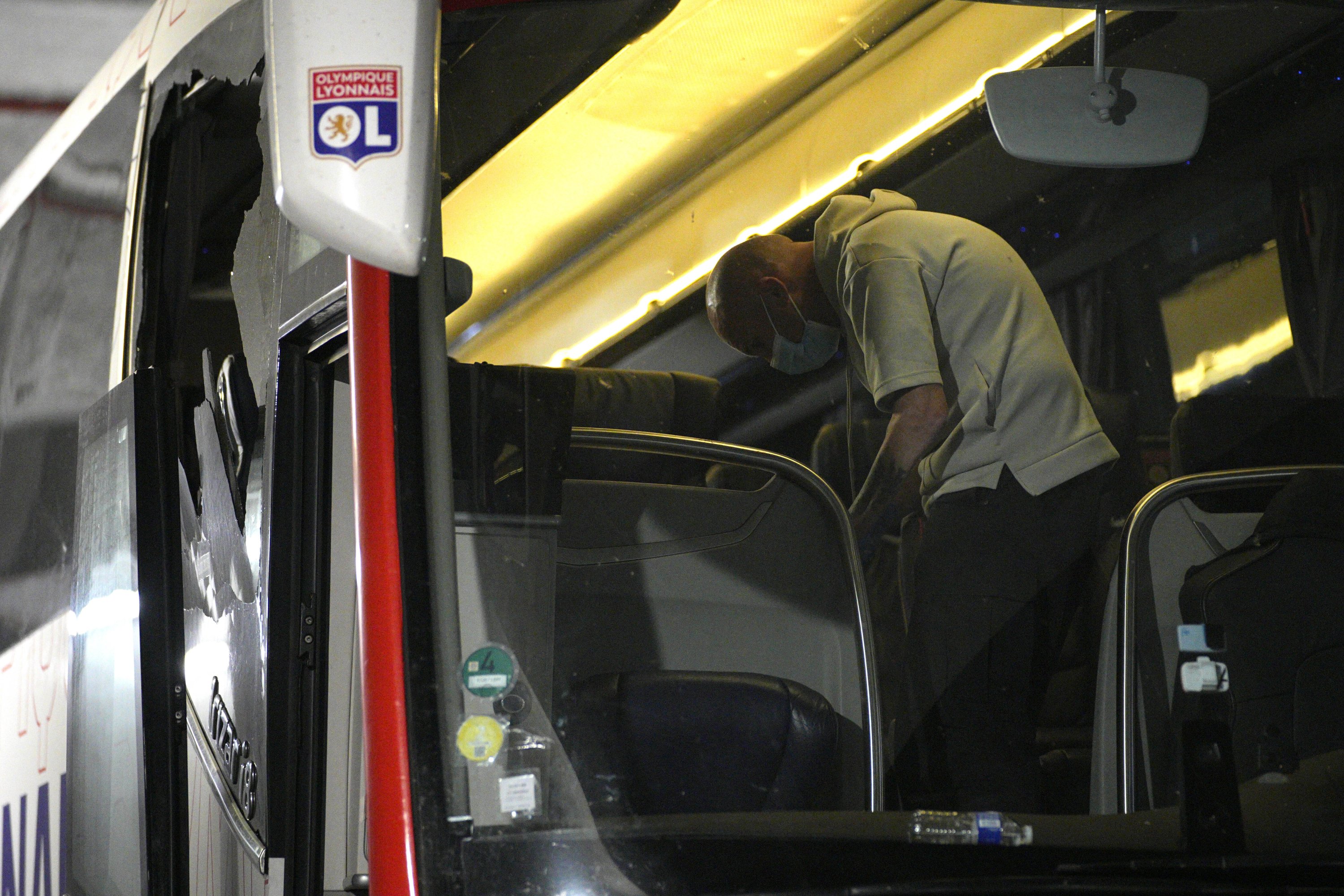 Police take finger prints in a bus that the Lyon team were traveling in, before arriving at the Velodrome Stadium prior to the French Ligue 1 match against Marseille at the Velodrome Stadium, Marseille, France, Oct. 29, 2023. (AP Photo)